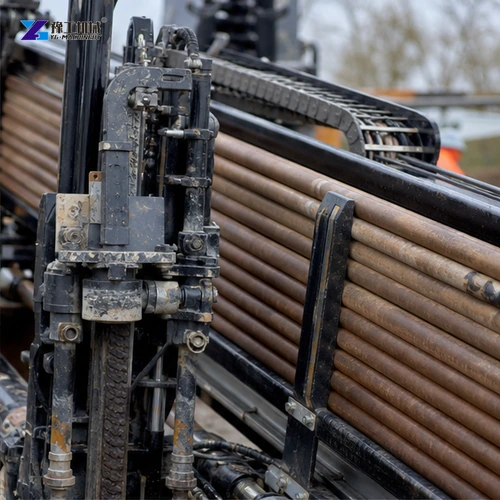Horizontal drilling carriage advancing steel drill rods