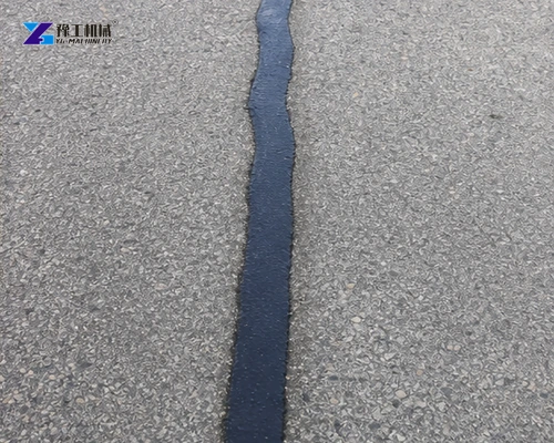 Finished narrow asphalt crack seal after surface treatment