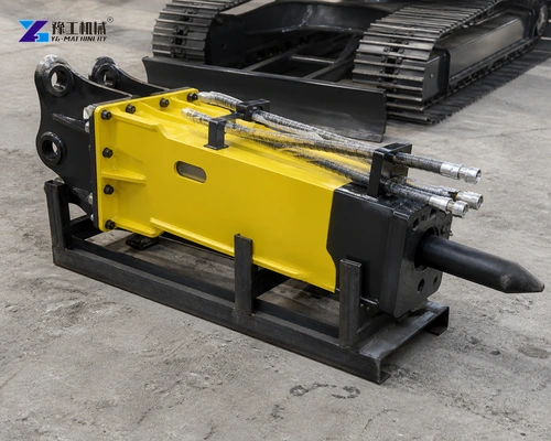 Yellow Hydraulic Breaker Supported On A Steel Cradle Near Excavator Tracks