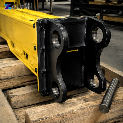 Black Breaker Mounting Ears With Aligned Bores Beside A Steel Pin