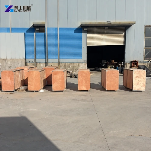 Packed cement spray machines in wooden crates outside factory