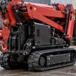 Tracked Spider Crane Transport And Access Guide Red tracked spider crane folded for transport on a paved surface