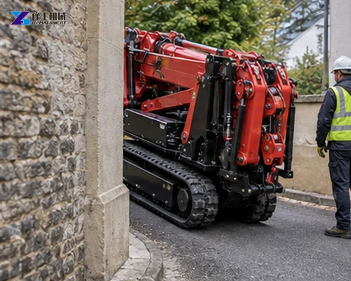 Tracked spider crane moving through a narrow stone passage with a guide