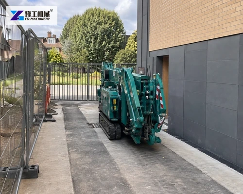 Tracked spider crane approaching restricted construction access