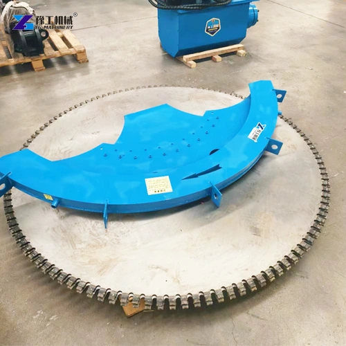 Circular rock saw disc beside its blue protective guard
