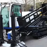 Horizontal directional drill with enclosed operator cab and raised rod frame