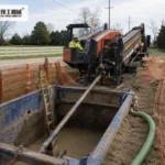 HDD Reamers: Reaming Stage And Tool Selection Guide Directional drilling rig aligned at bore entry