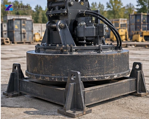 Complete excavator magnet attachment suspended from the carrier for inspection