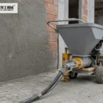 Mortar Pump Machine Practical Output And Site Planning Mortar spraying machine staged beside masonry wall