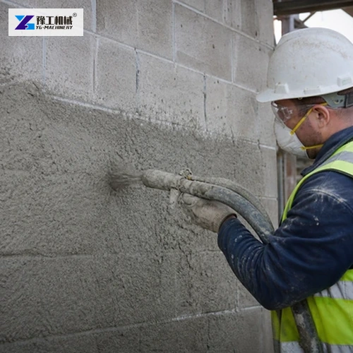 Operator applying mortar evenly to block wall