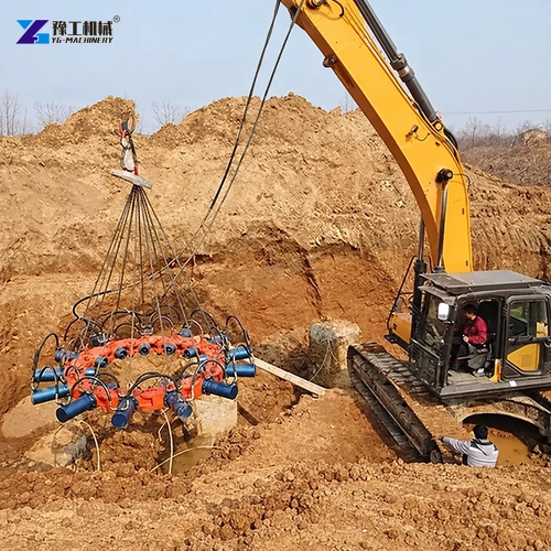Hydraulic pile breaker lifted by excavator during pile removal