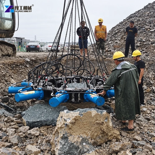 Workers positioning hydraulic pile breaker on exposed concrete pile