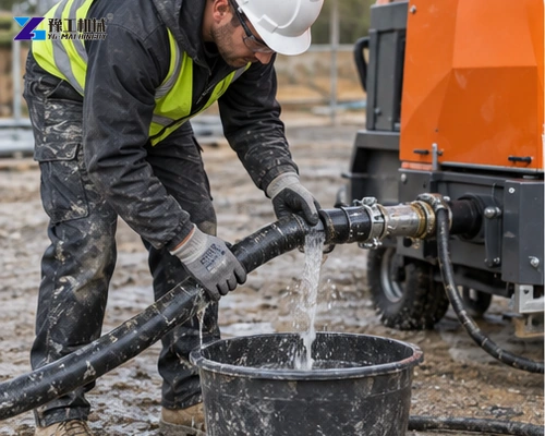 Crew cleaning pump and hose after render spraying