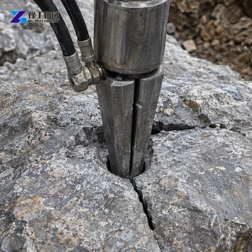 Splitter wedge seated in a predrilled rock hole