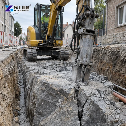 Hydraulic rock splitter working inside a utility trench