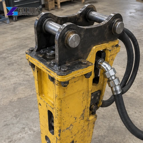 Close view of hydraulic breaker mounting pins and carrier bracket