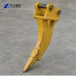 Ripper Tooth vs Hydraulic Breaker for Weathered Rock Excavator ripper tooth attachment shown beside fractured quarry rock