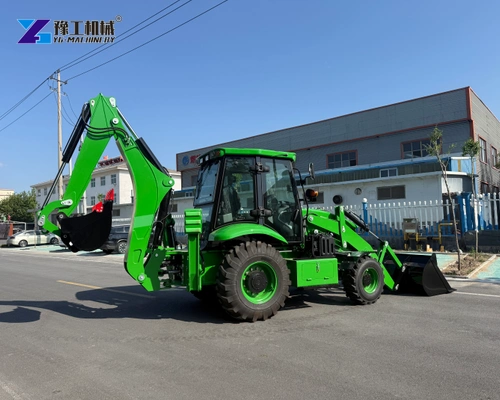 Green Backhoe Loader With Both Working Attachments Outside A Factory