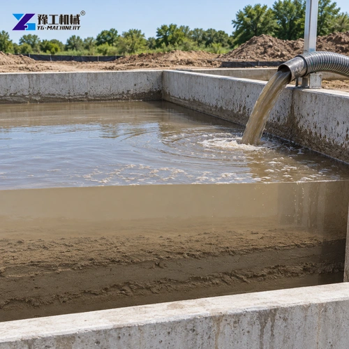 Hose entering a contained basin holding settling muddy water