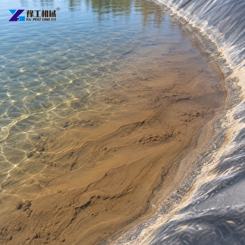 Fine settled silt visible beneath shallow water along a basin edge