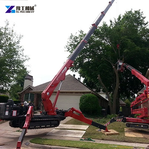 Compact red spider crane set up beside a paved residential driveway